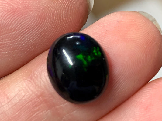 Natural Ethiopian Black Opal 10x12x5mm cabochon