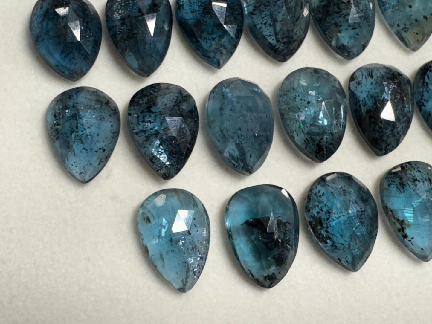 Faceted Moss Kyanite pear 10x14mm cabochon