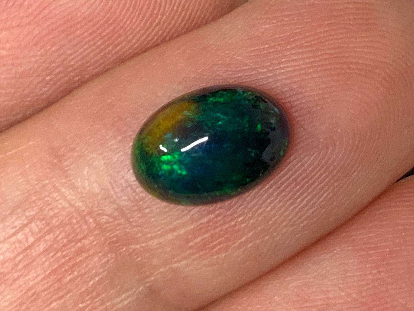 Natural Ethiopian Black Opal 6x9x3mm cabochon