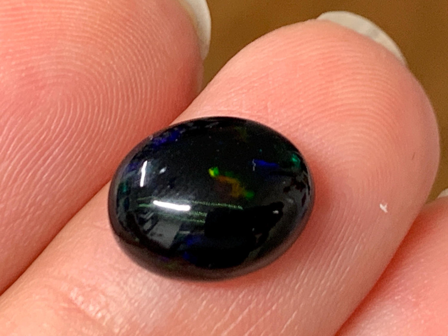 Natural Ethiopian Black Opal 9x11x4mm cabochon