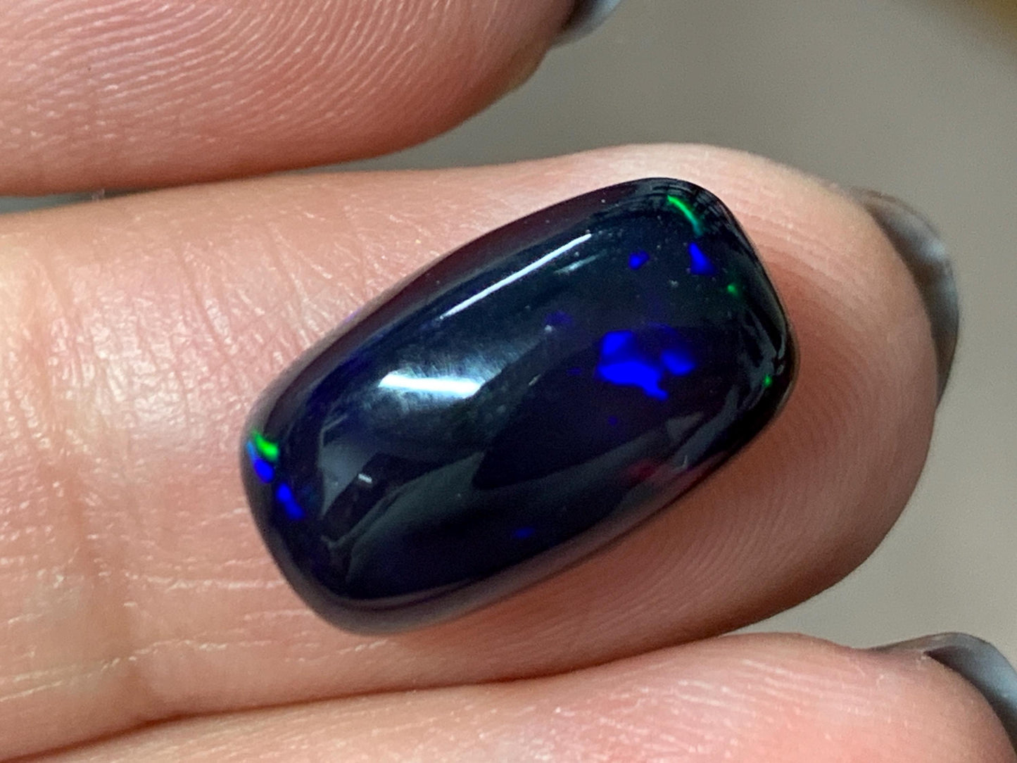 Natural Ethiopian Black Opal 8x14x5mm cabochon