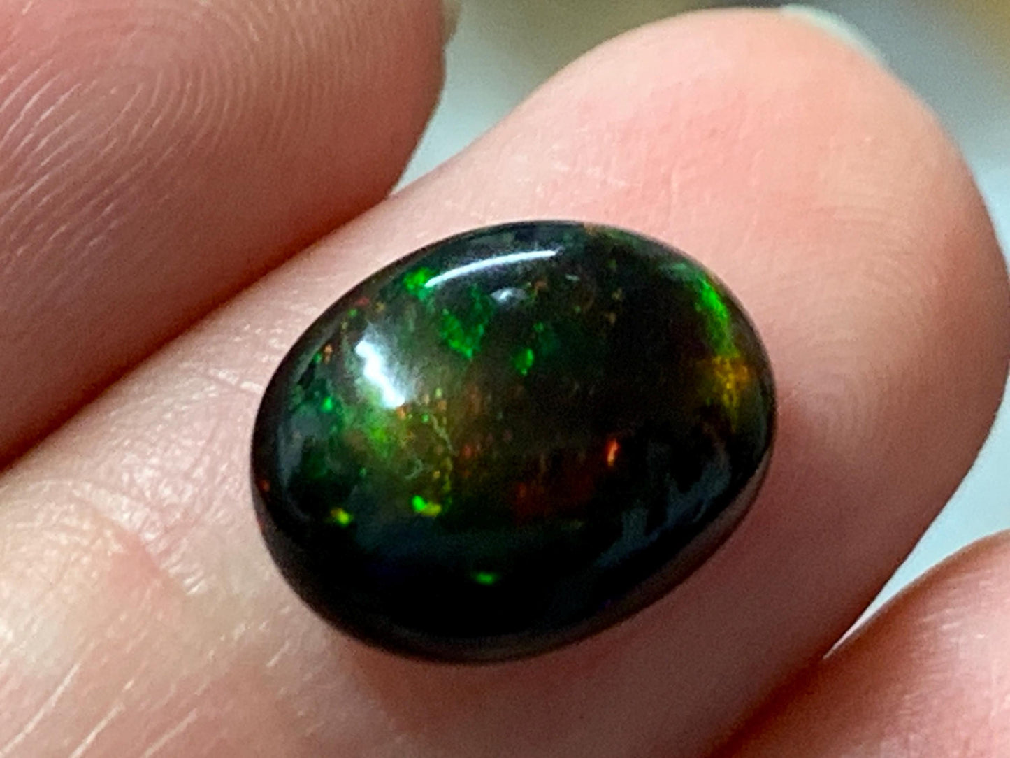 Natural Ethiopian Black Opal 9x12x5mm cabochon