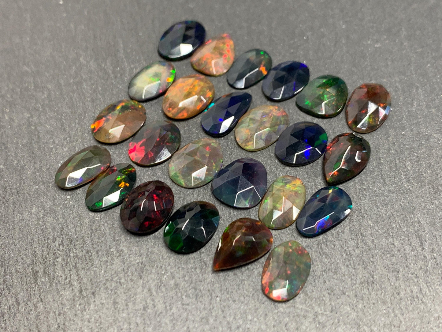 Faceted Black Ethiopian Opal 10-11mm long cabochon
