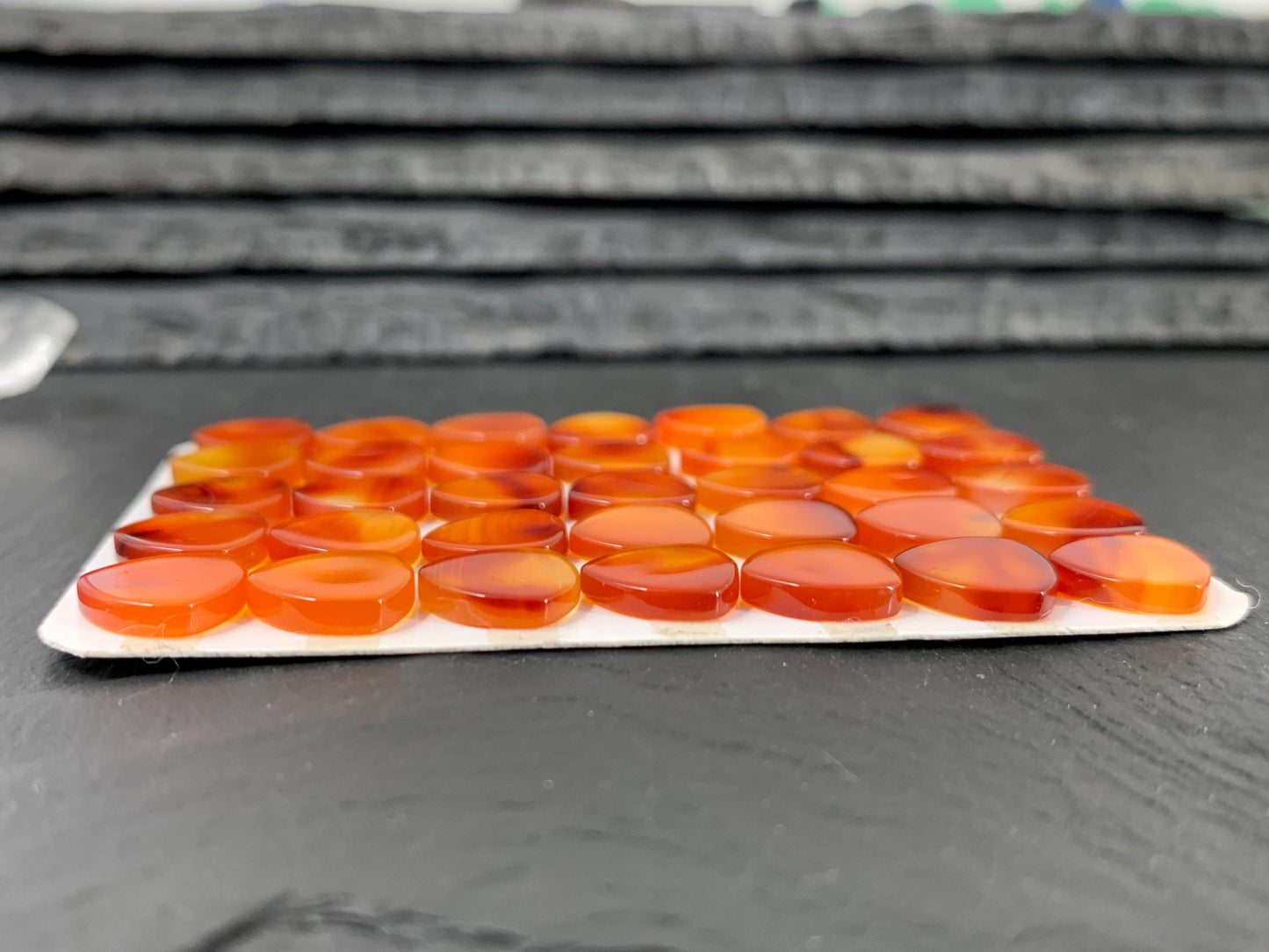 Flat Carnelian curved triangle 10mm cabochon - Calibrated cabochons