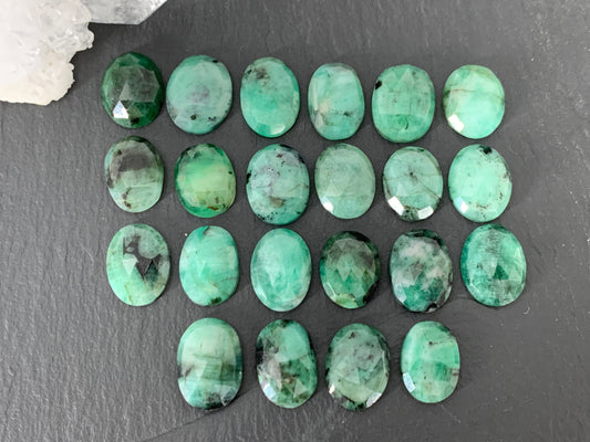 Faceted Emerald oval 13-14mm cabochon