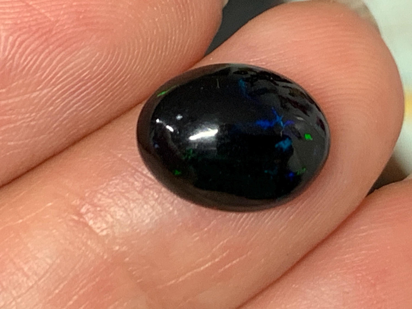 Natural Ethiopian Black Opal 9x12x5mm cabochon