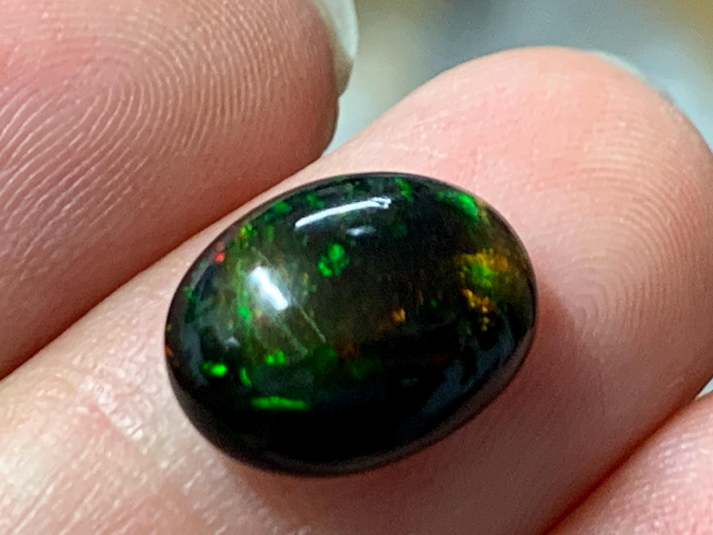 Natural Ethiopian Black Opal 9x12x5mm cabochon