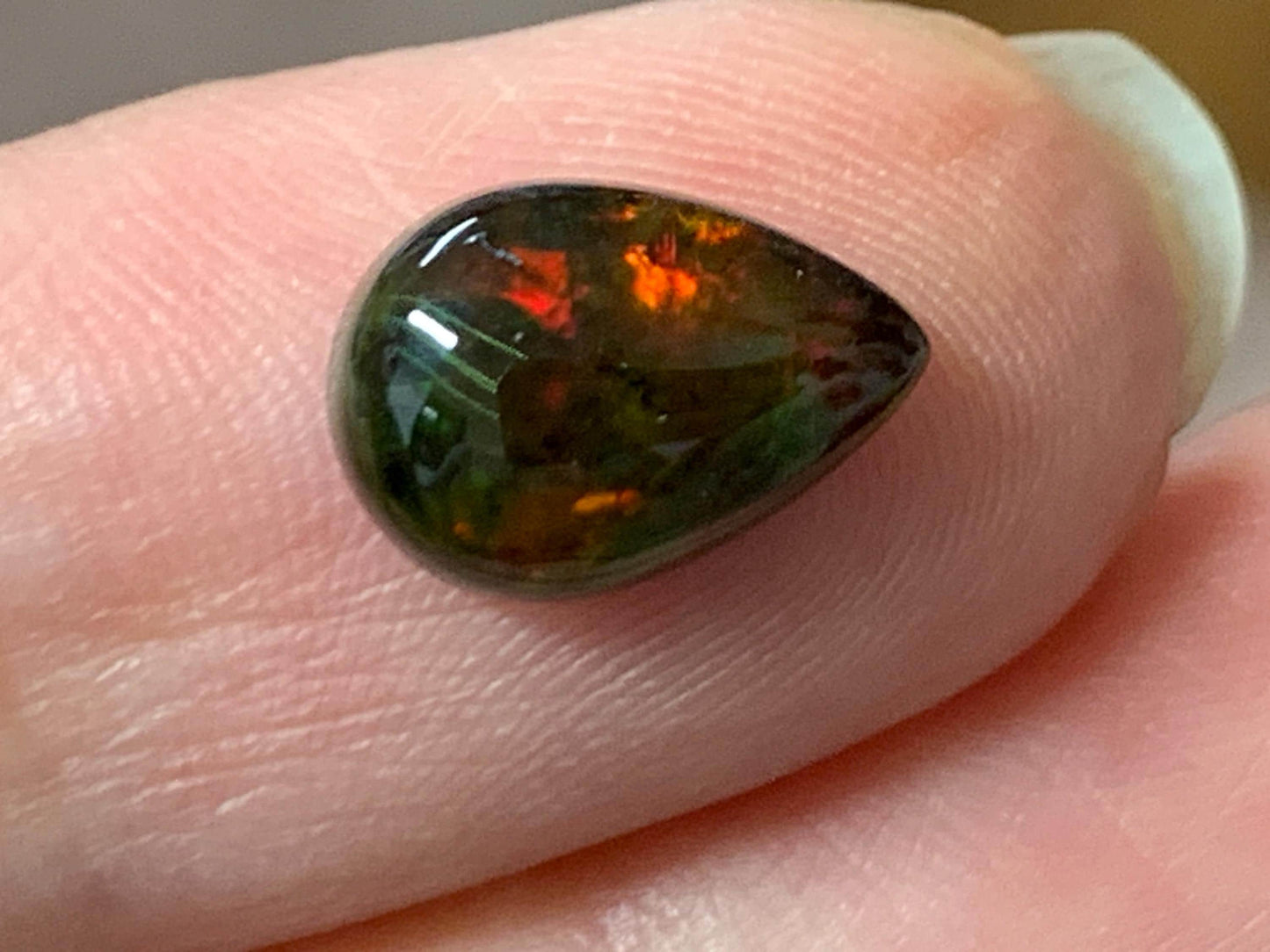 Natural Ethiopian Black Opal 7x11x3.5mm cabochon