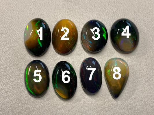 Natural Ethiopian Black Opal oval, pear 13-15mm long cabochon