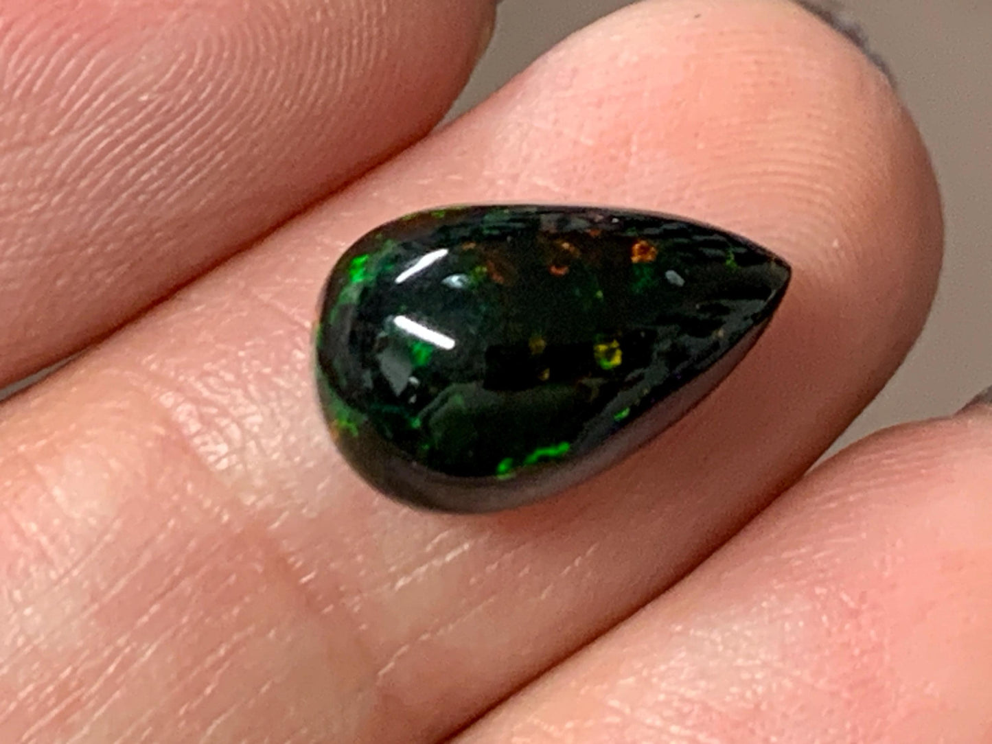 Natural Ethiopian Black Opal 8x14x6mm cabochon