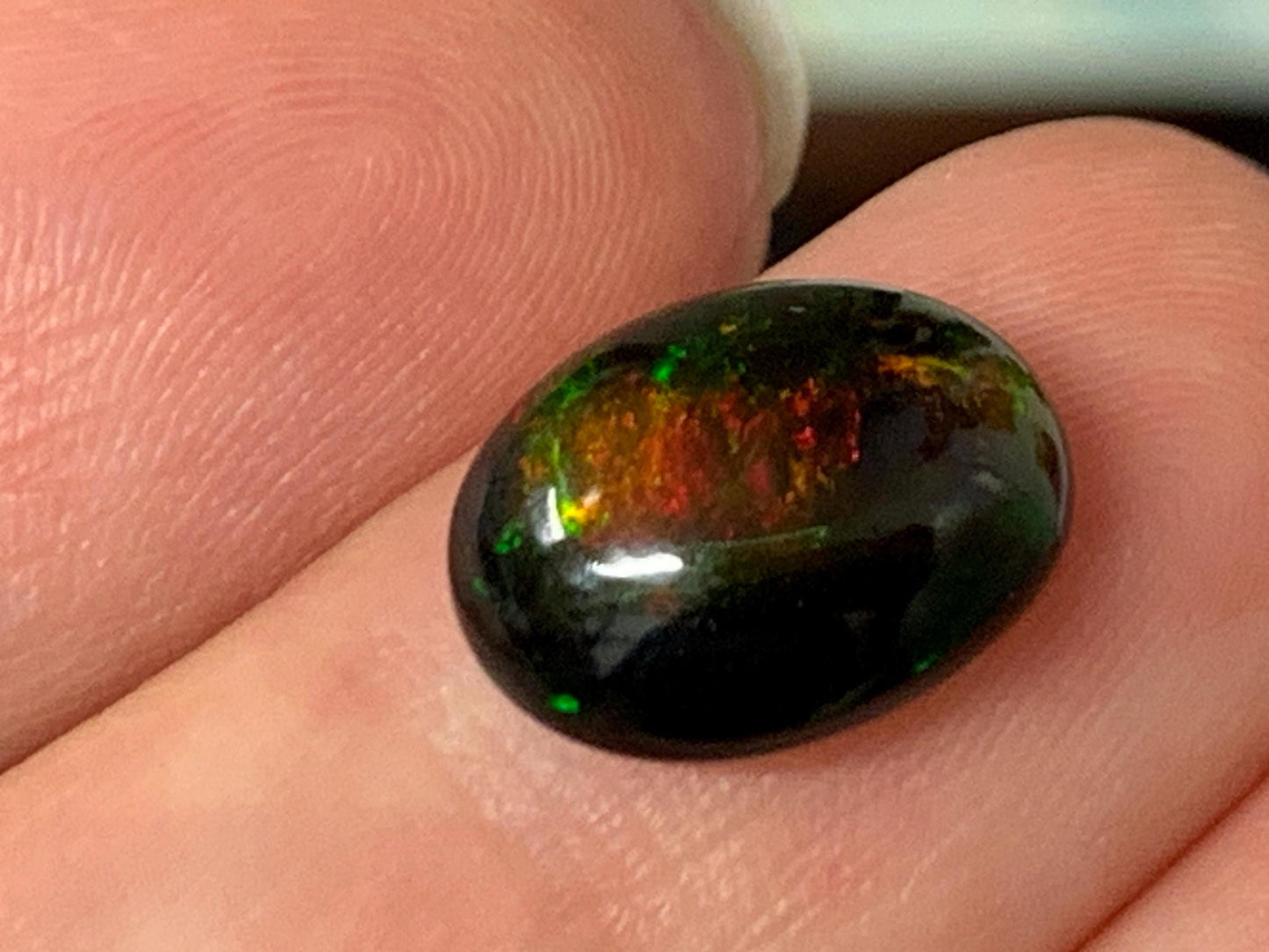 Natural Ethiopian Black Opal 9x12x5mm cabochon