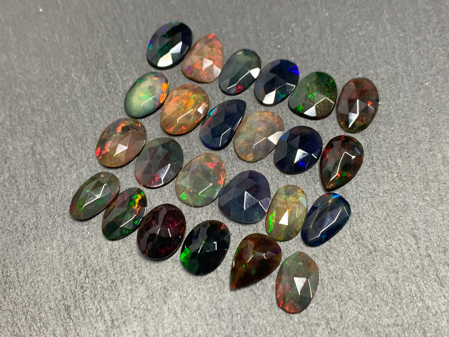 Faceted Black Ethiopian Opal 10-11mm long cabochon
