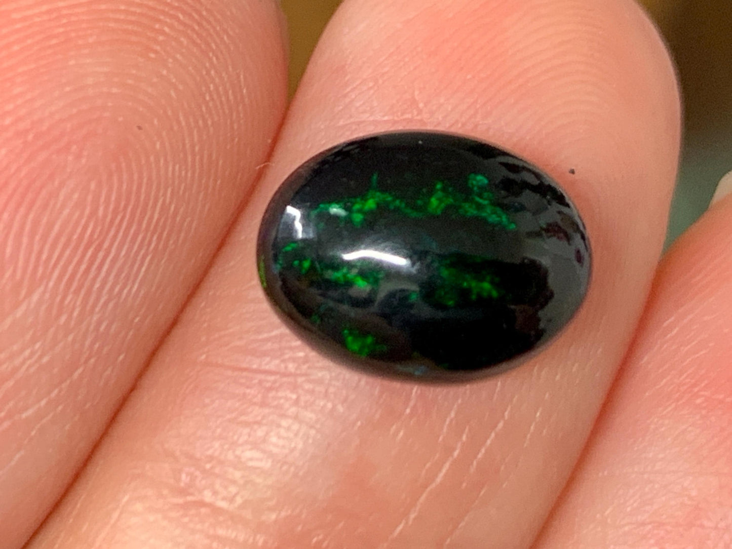 Natural Ethiopian Black Opal 8x11x4mm cabochon