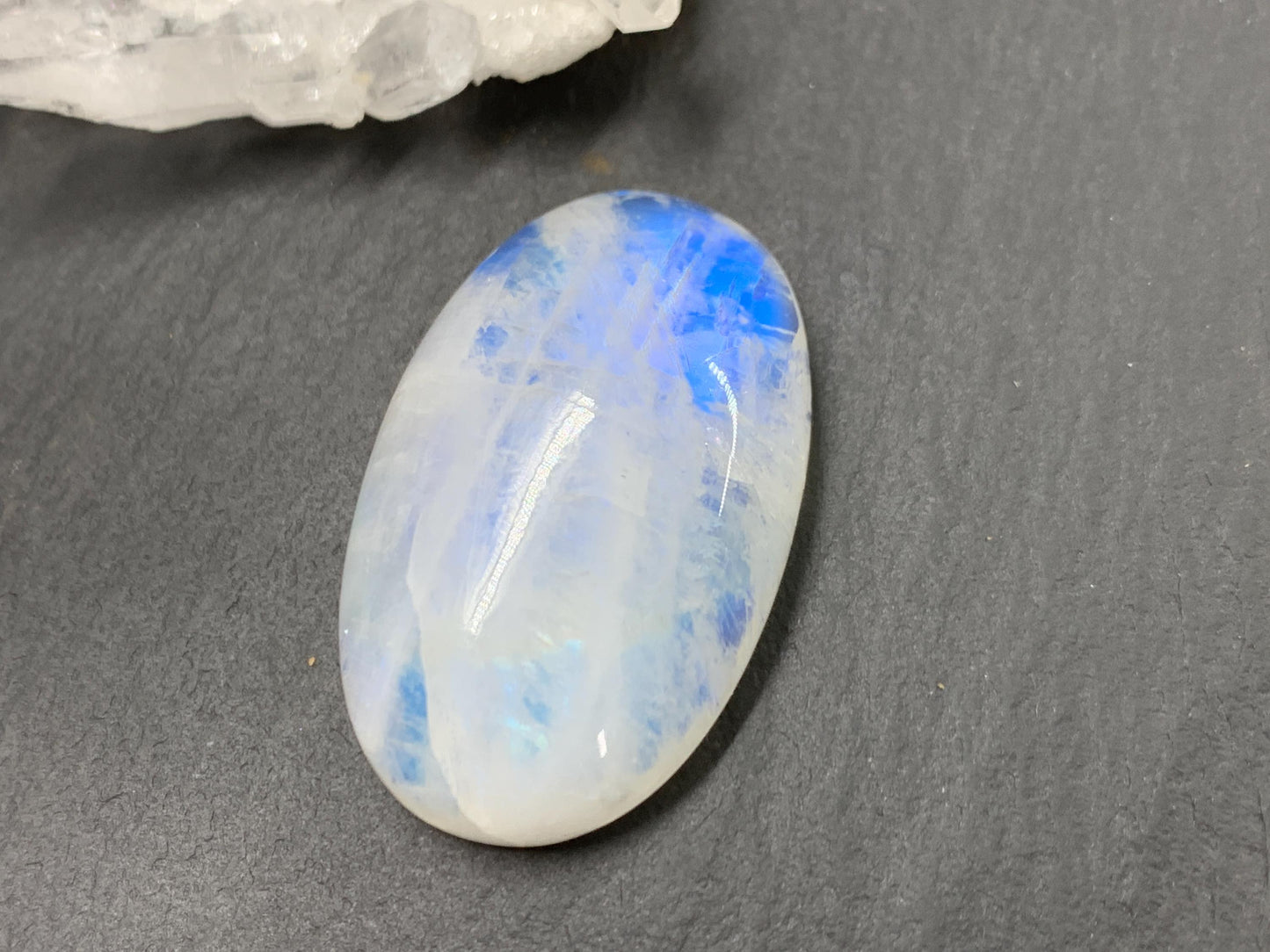 Rainbow Moonstone oval 33x21x9mm cabochon