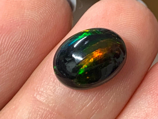 Natural Ethiopian Black Opal 9x12x5mm cabochon