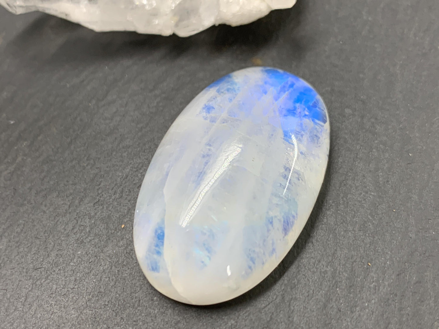 Rainbow Moonstone oval 33x21x9mm cabochon