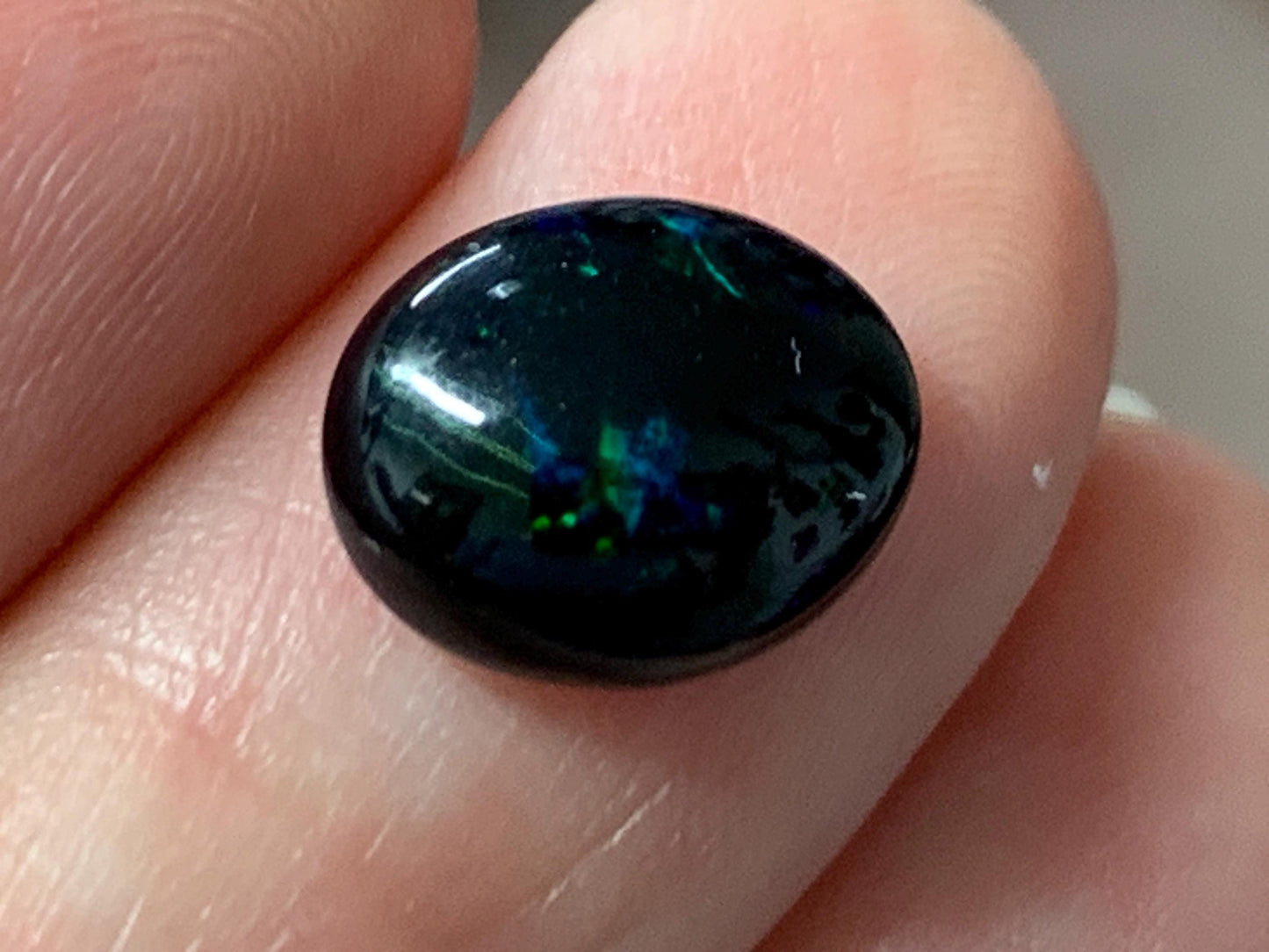 Natural Ethiopian Black Opal 9x11x4mm cabochon