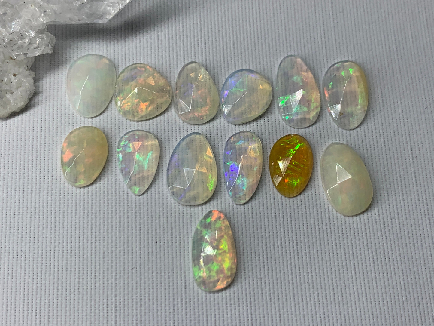 Faceted Ethiopian Opal 10-12mm long cabochon