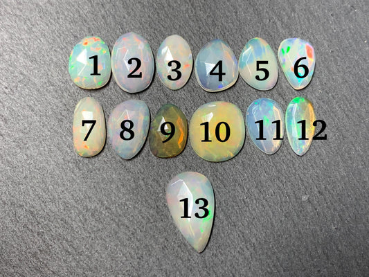 Faceted Ethiopian Opal 11-16mm long cabochon