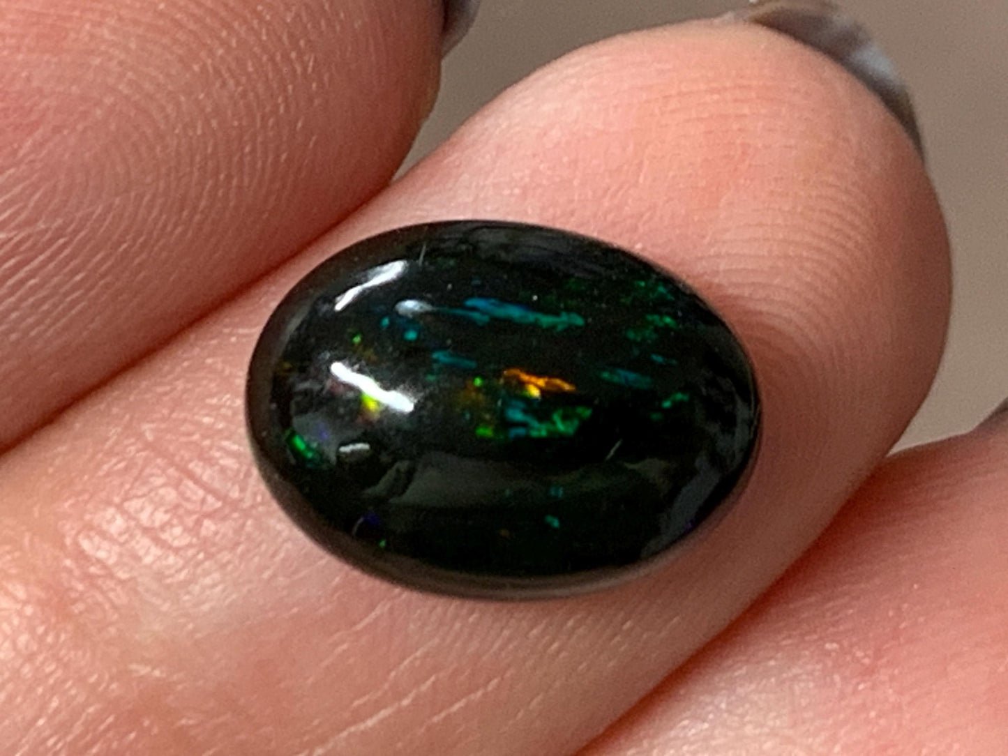 Natural Ethiopian Black Opal 9x12x4mm cabochon