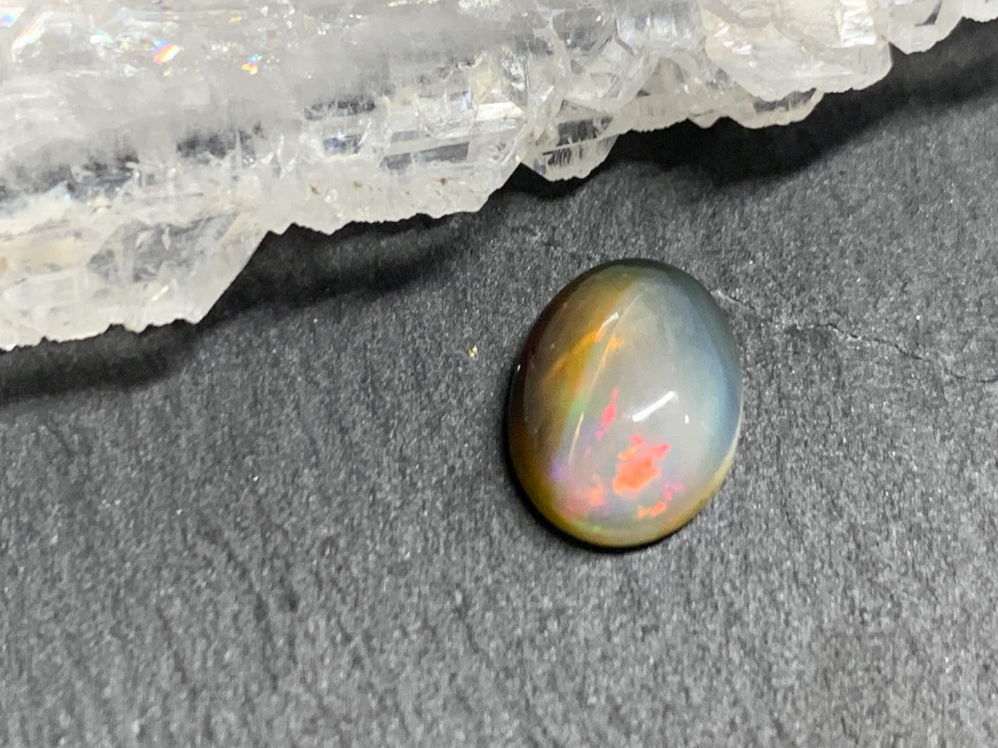 Natural Black Ethiopian Opal oval 7x10x4mm cabochon