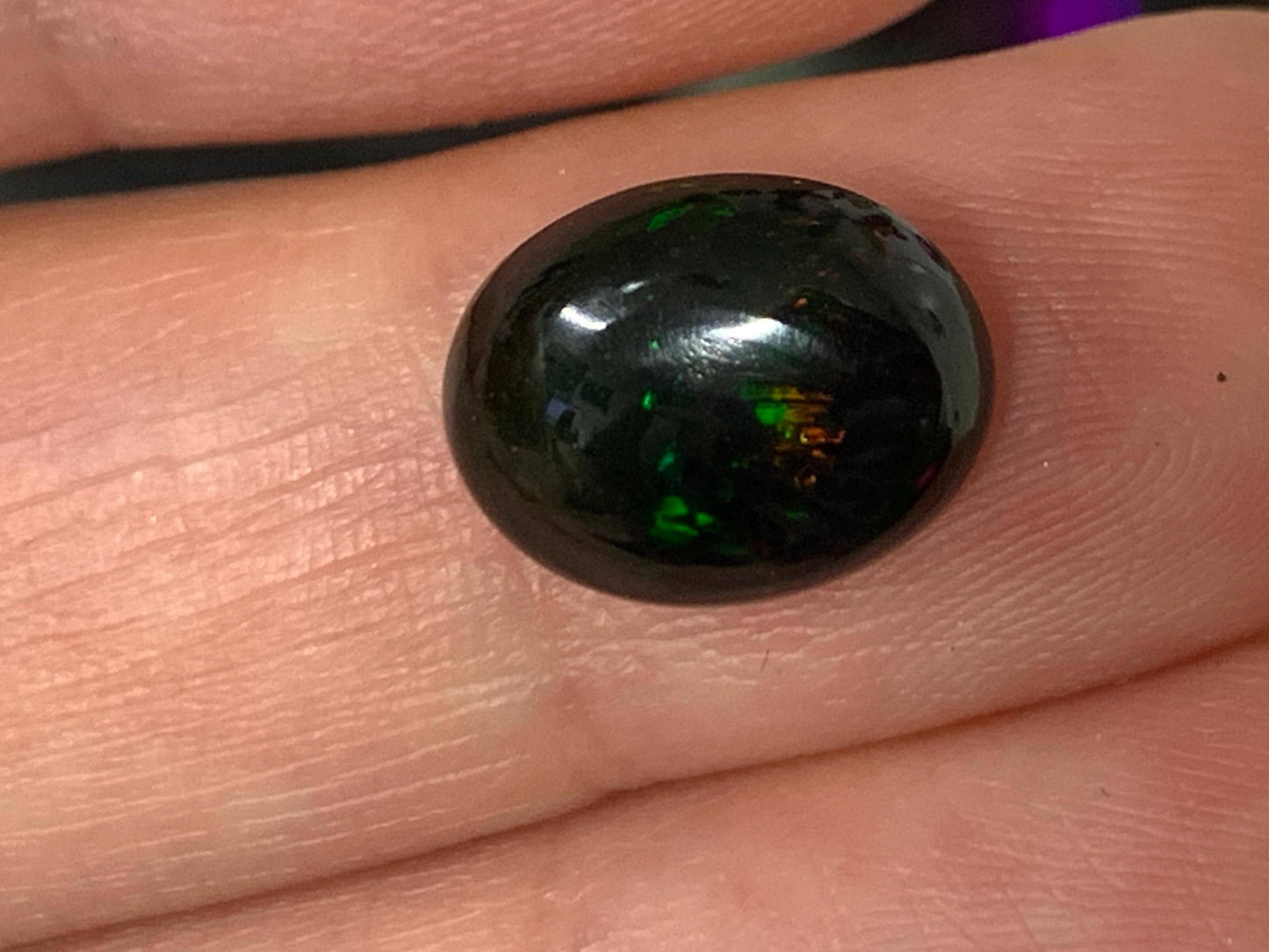 Natural Ethiopian Black Opal 9x12x5mm cabochon