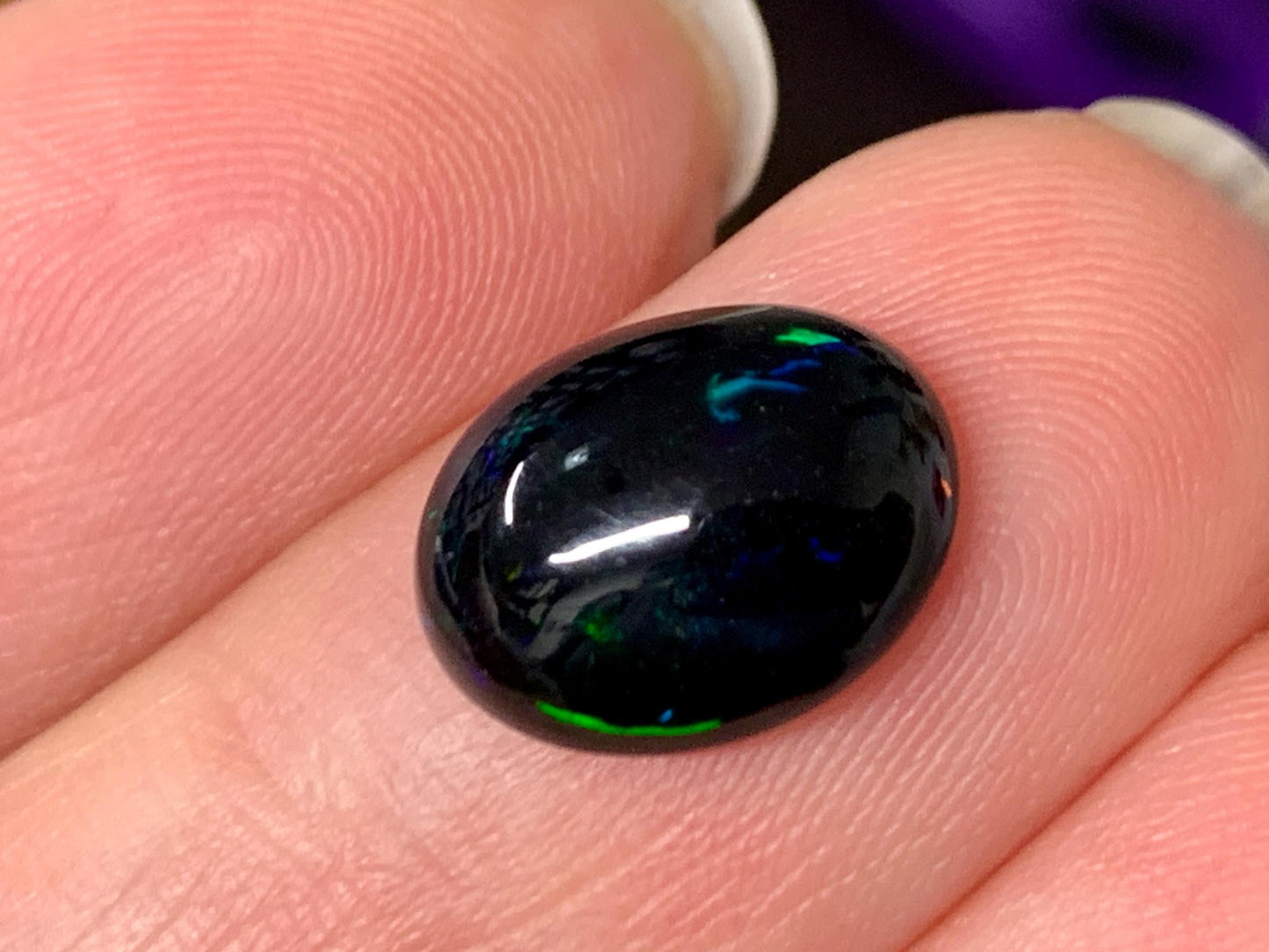 Natural Ethiopian Black Opal 9x11x4mm cabochon