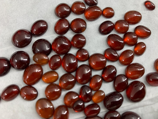 Hessonite Garnet oval, round 7-11mm long cabochon
