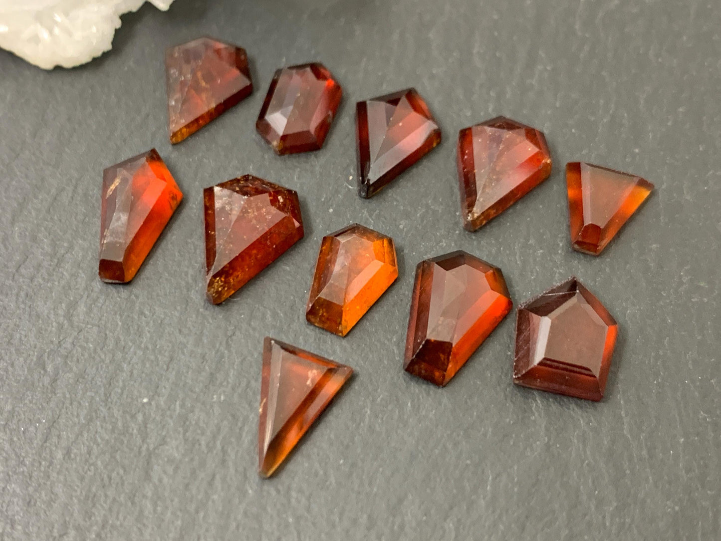 Faceted Hessonite Garnet 9-12mm long cabochon.
