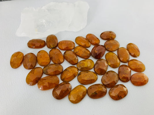 Faceted orange Kyanite oval 12-13mm long cabochons