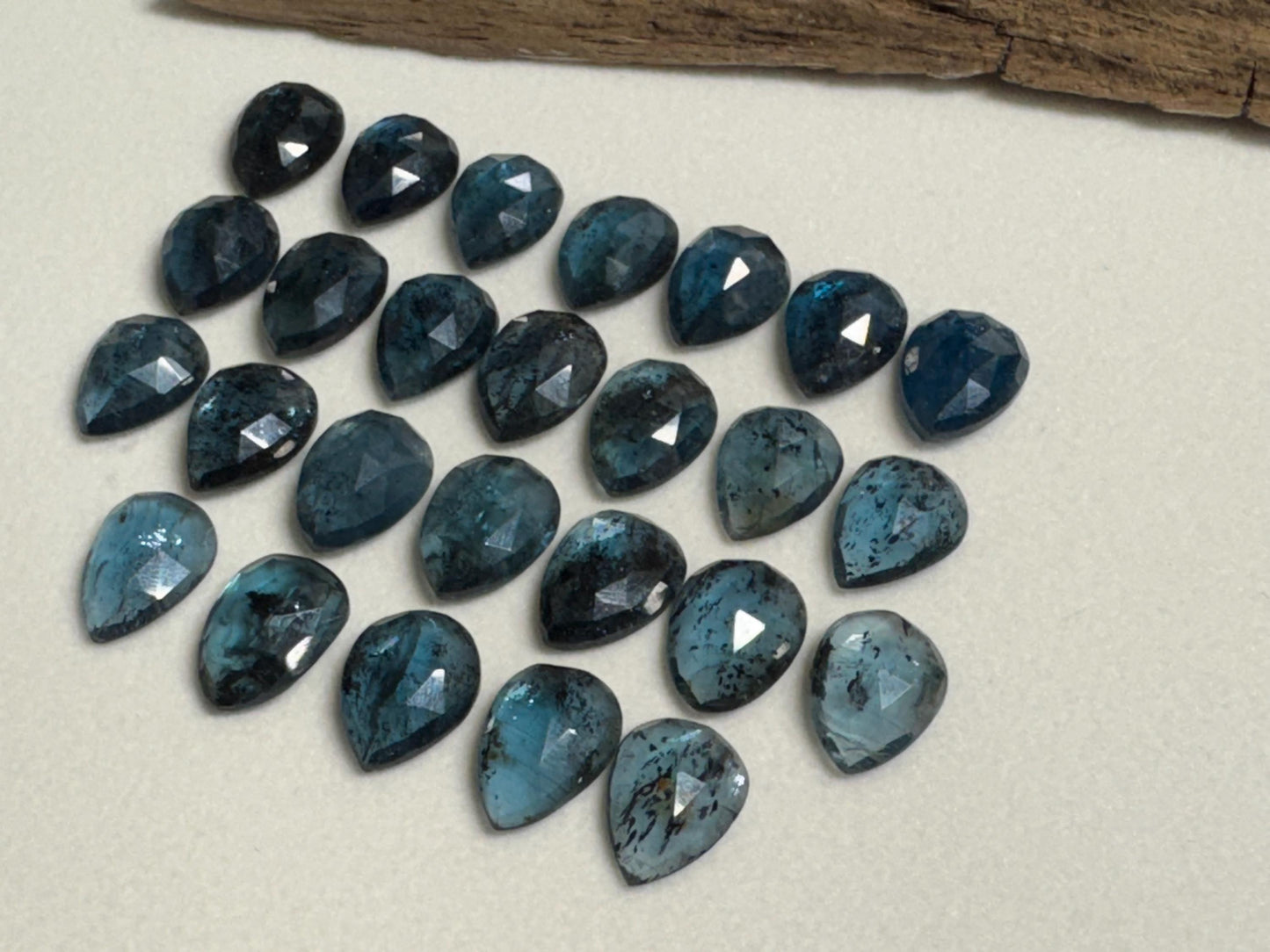 Faceted Moss Kyanite pear 10x14mm cabochon