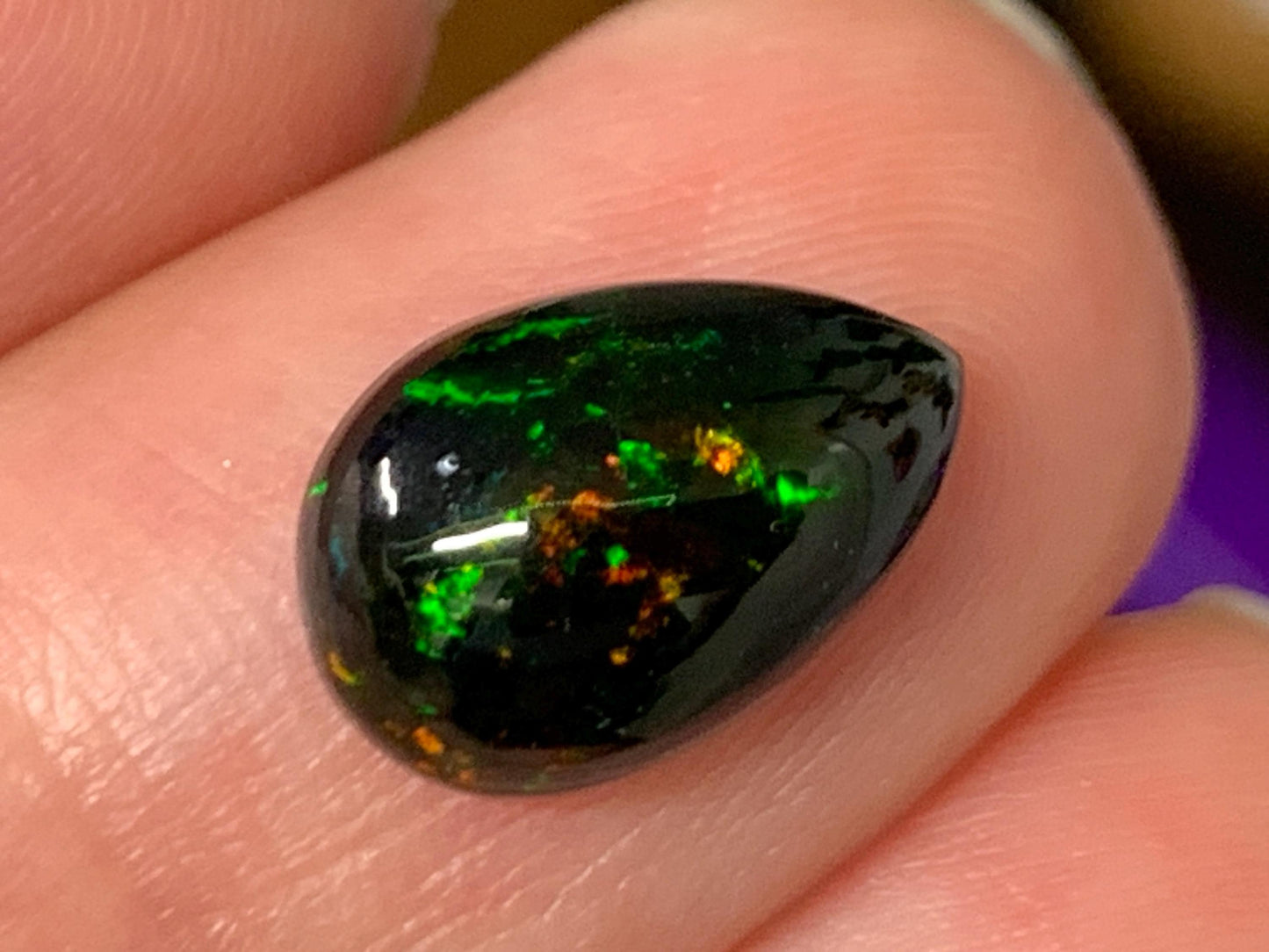 Natural Ethiopian Black Opal 8x12x4mm cabochon