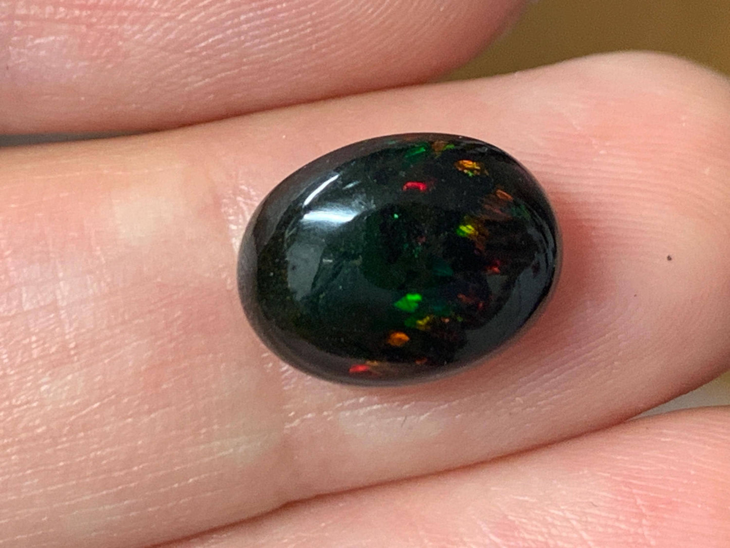 Natural Ethiopian Black Opal 9x12x5mm cabochon