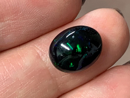 Natural Ethiopian Black Opal 10x12x5mm cabochon