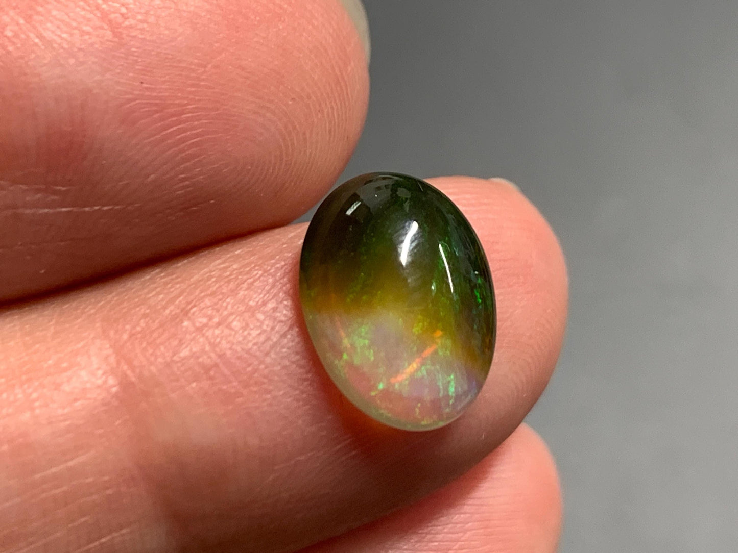 Natural Black Ethiopian Opal oval 9x11x4mm cabochon