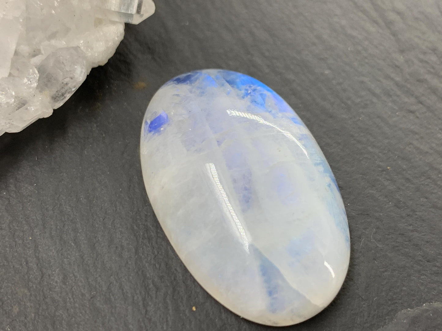 Rainbow Moonstone oval 33x21x9mm cabochon
