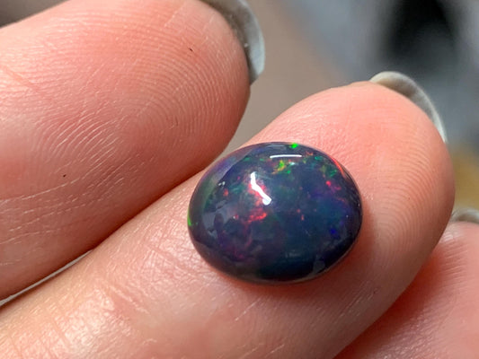 Natural Ethiopian Black Opal 8x11x4mm cabochon