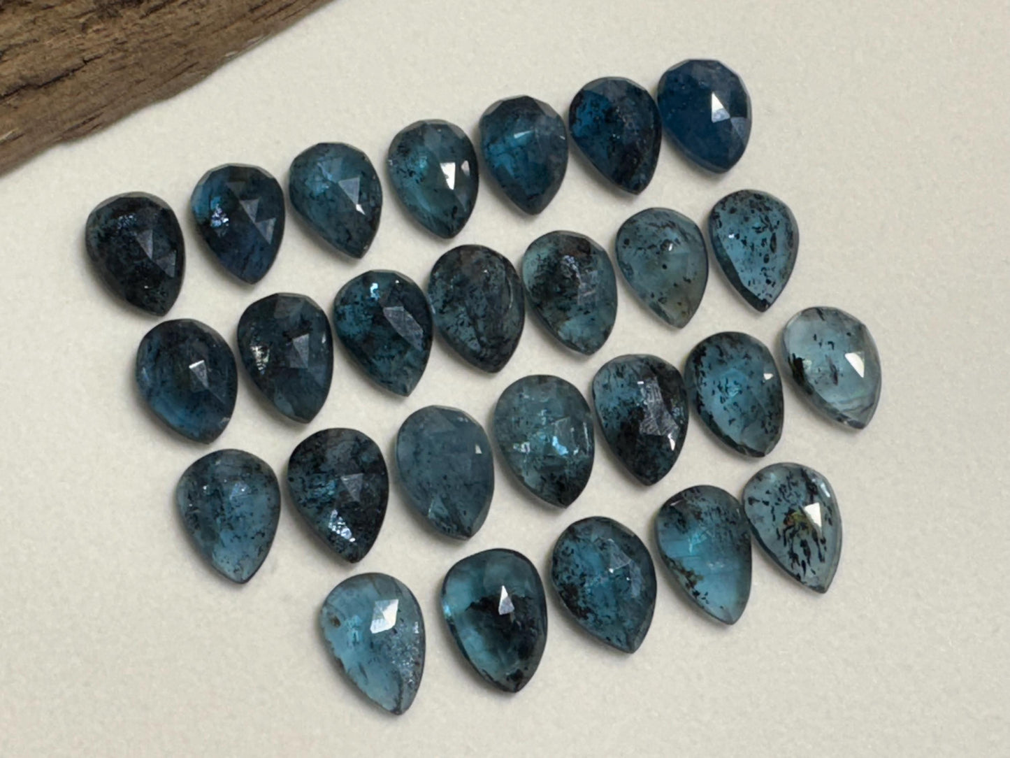 Faceted Moss Kyanite pear 10x14mm cabochon