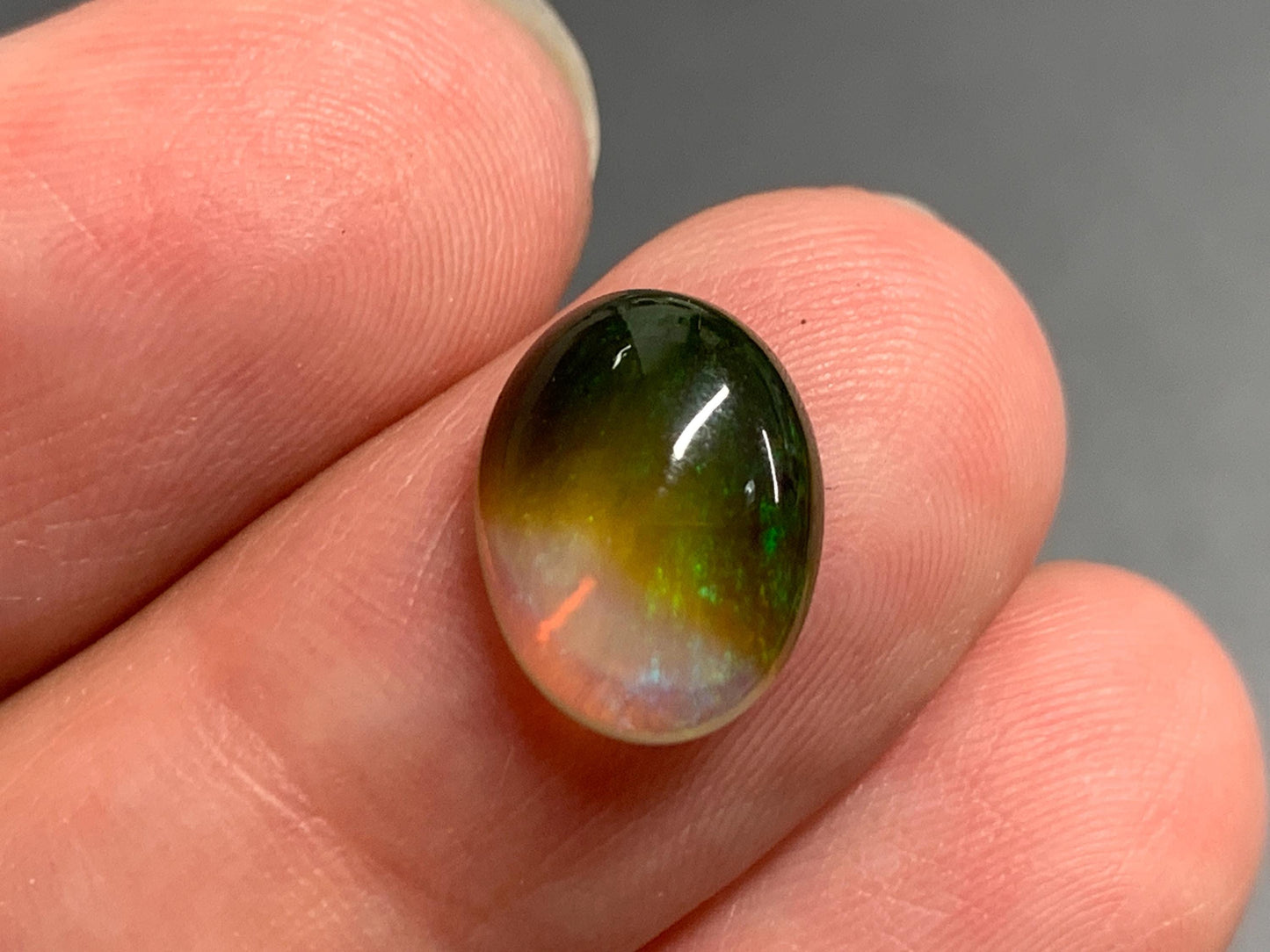 Natural Black Ethiopian Opal oval 9x11x4mm cabochon